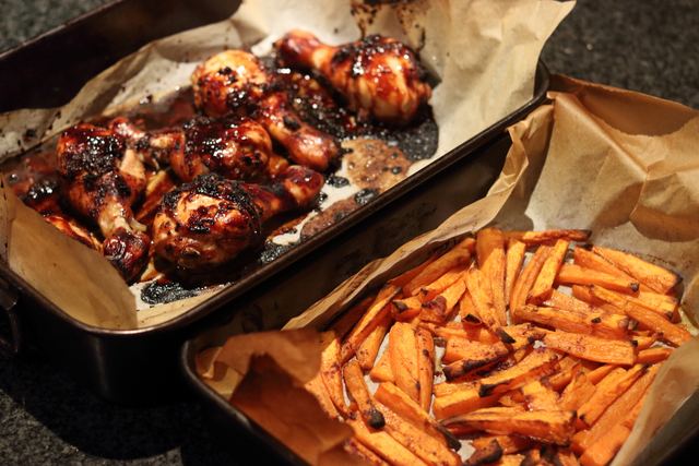 Sticky ginger & soy chicken drumsticks with sweet potato wedges