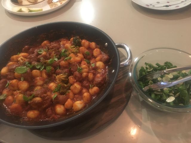 Sausage gnocchi and warm kale & bean salad
